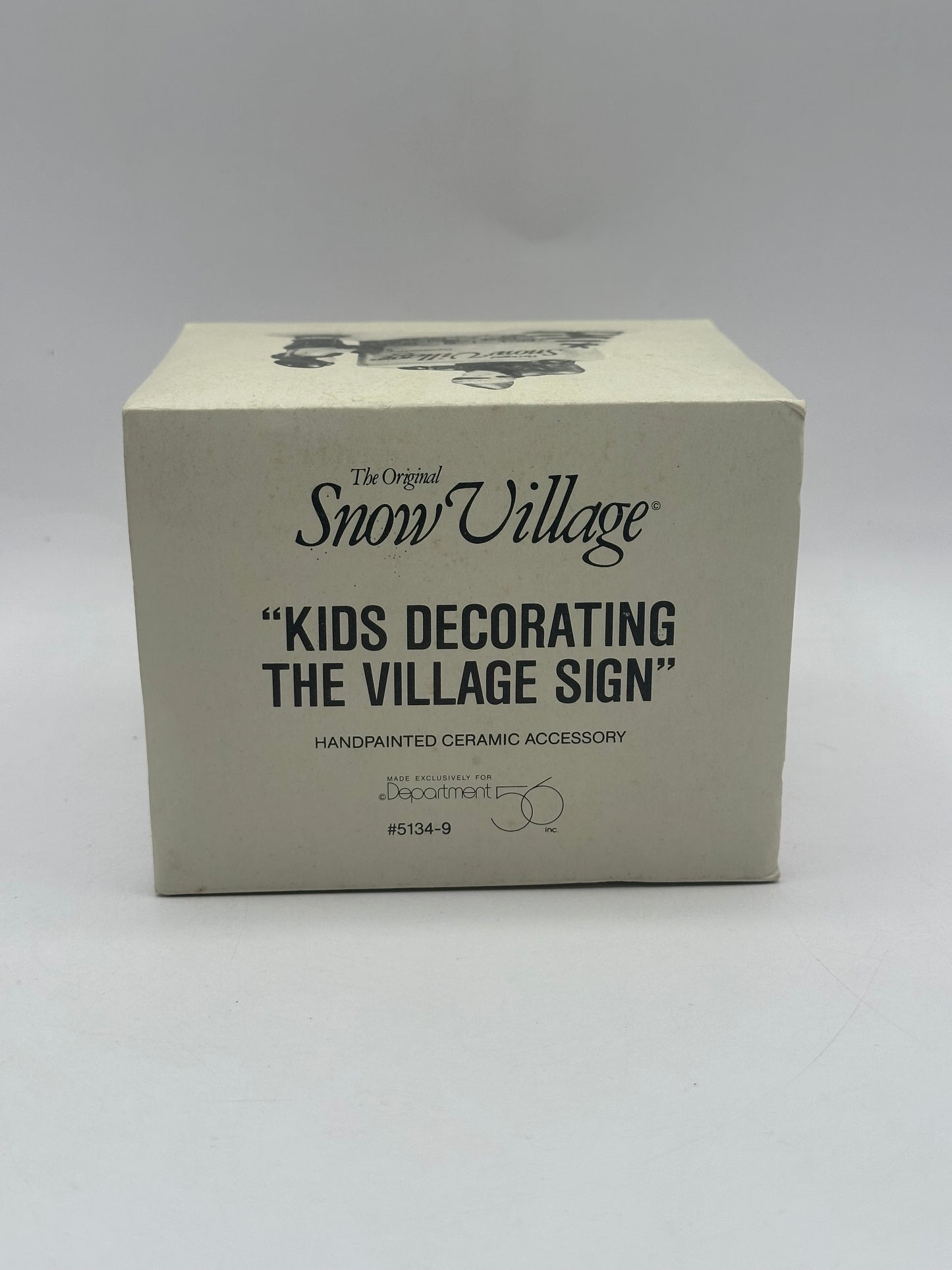 Dept 56 Original Snow Village Kids Decorating The Village Sign