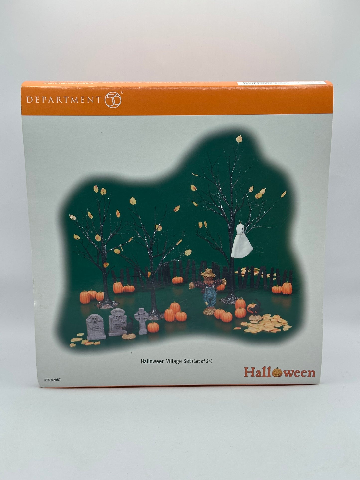 Original packaging of the Department 56 Snow Village Halloween set with box details and contents overview.