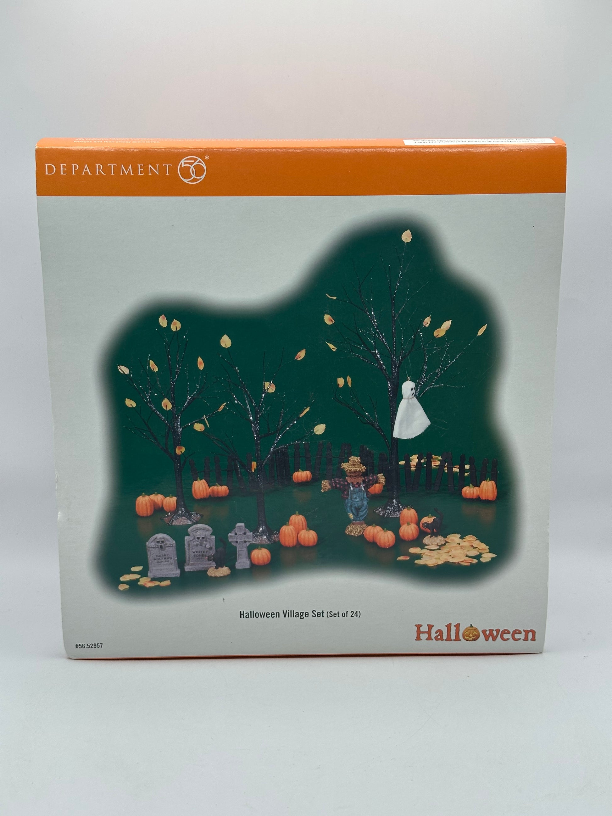 Original packaging of the Department 56 Snow Village Halloween set with box details and contents overview.